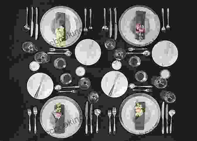 A Beautifully Set Table With Elegant Cutlery And Crystal Glassware, Inviting Guests To An Unforgettable Dining Experience The Scavenger S Guide To Haute Cuisine: How I Spent A Year In The American Wild To Re Create A Feast From The Classic Recipes Of French Master Chef Auguste Escoffier