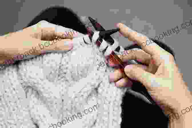 A Close Up Image Of A Person's Hands Knitting A Cable Stitch Lily Chin S Knitting Tips And Tricks: Shortcuts And Techniques Every Knitter Should Know