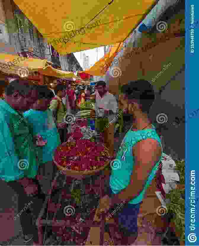 A Group Of People Laughing And Interacting In A Colorful Indian Market. David Wallace Goes To India