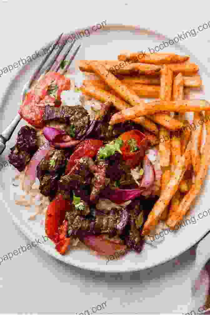 A Hearty Plate Of Lomo Saltado, Showcasing The Vibrant Colors And Savory Flavors Of The Peruvian Stir Fry. Peruvian Recipes For You And Your Family