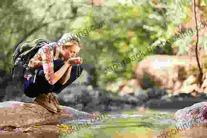 A Hiker Sipping Water From A Mountain Stream Waterton Lakes National Park Hiking Guide