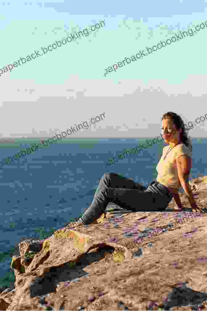 A Photograph Of A Woman Standing On A Clifftop, Looking Out At The Sea. A Little Bit Broken: A Memoir
