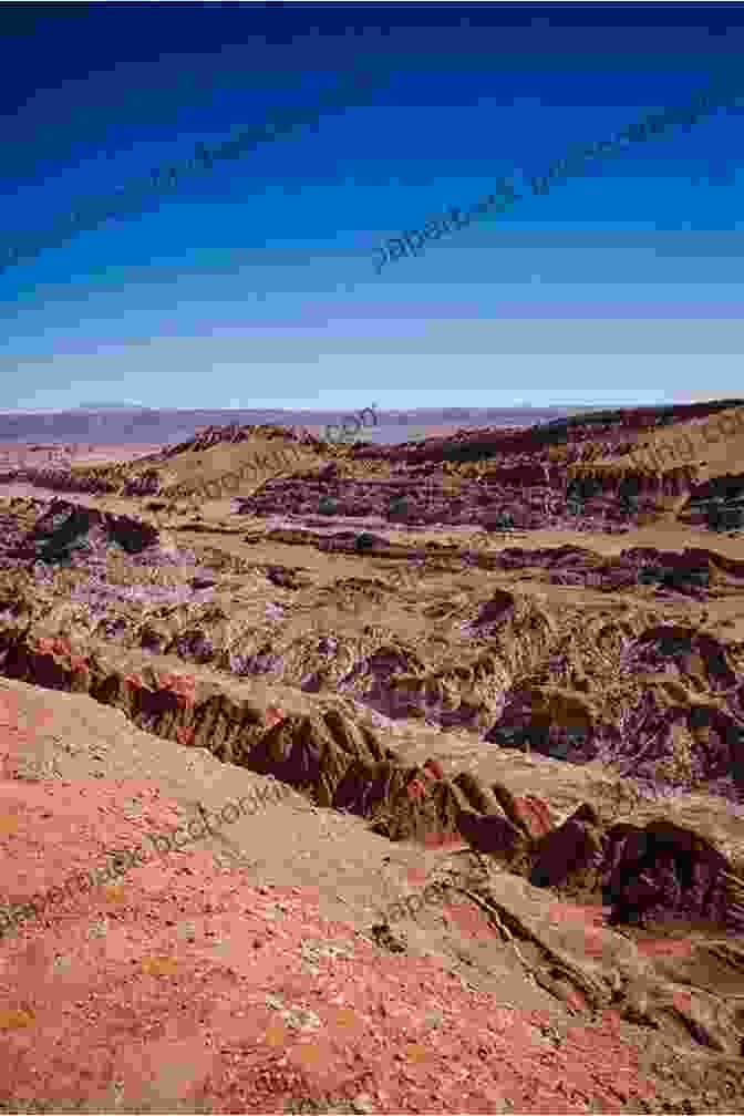 Otherworldly Landscape Of The Atacama Desert, With Salt Flats, Barren Mountains, And A Clear Blue Sky Desert Biomes Around The World (Exploring Earth S Biomes)